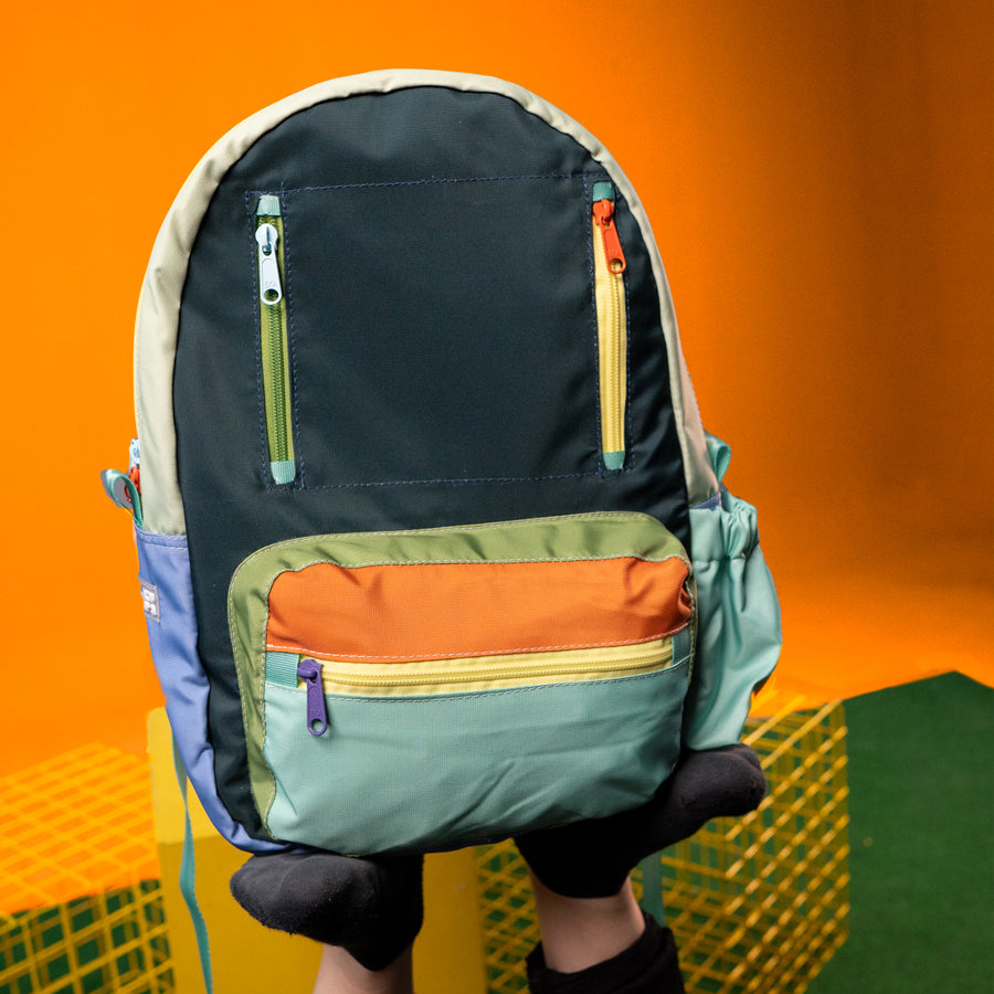 mini-tatacoa-maleta-bolsillos-colores-bloques-amarillo-azul-verde-menta-naranja-dinosaurios-anyurasi-kupa_2.jpg